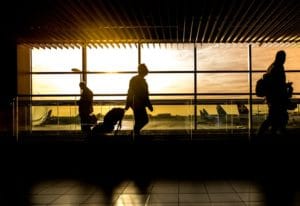 person walking through an airport 