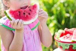 child eating a watermelon 